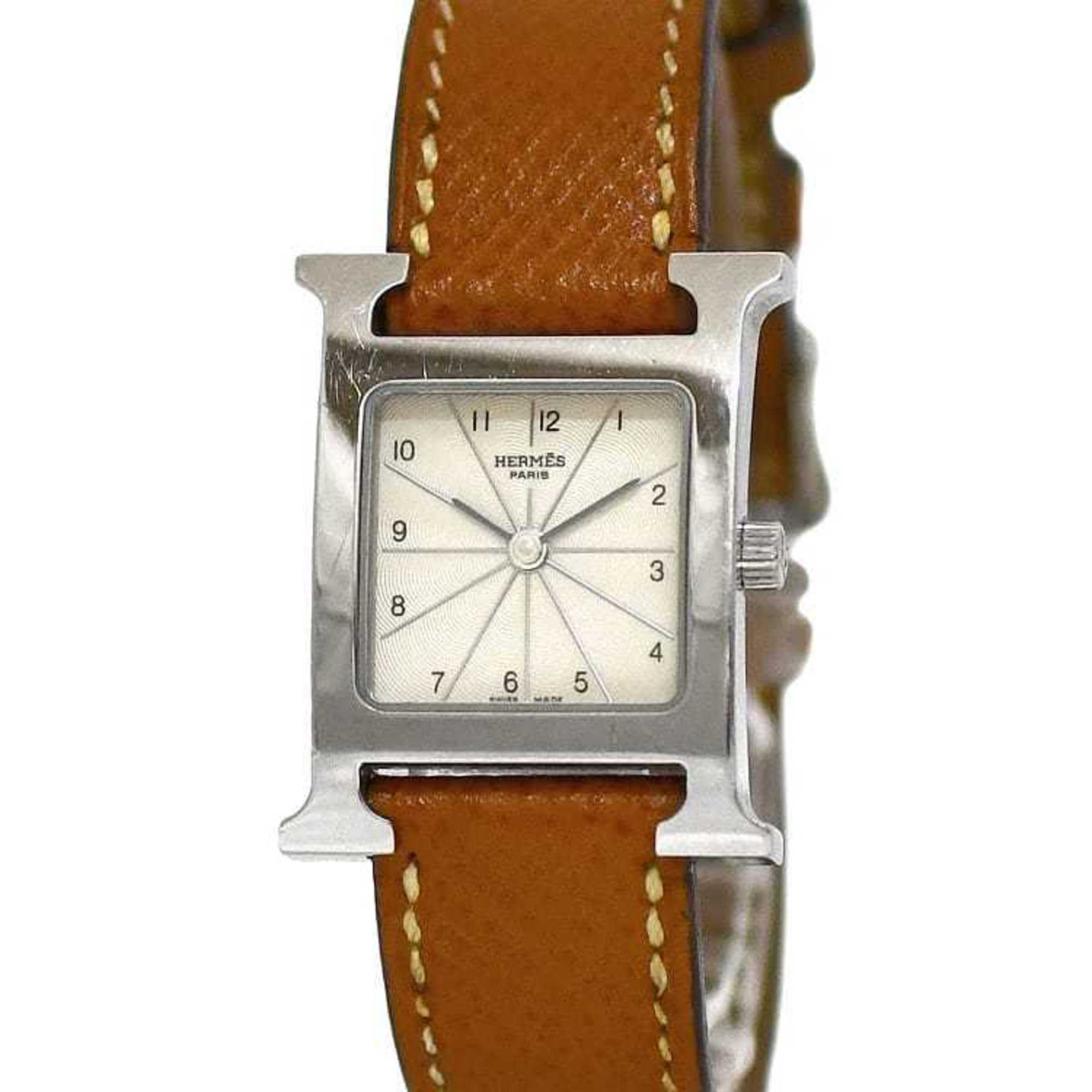 Hermès Heure H in a beige and brown colourway on a leather strap