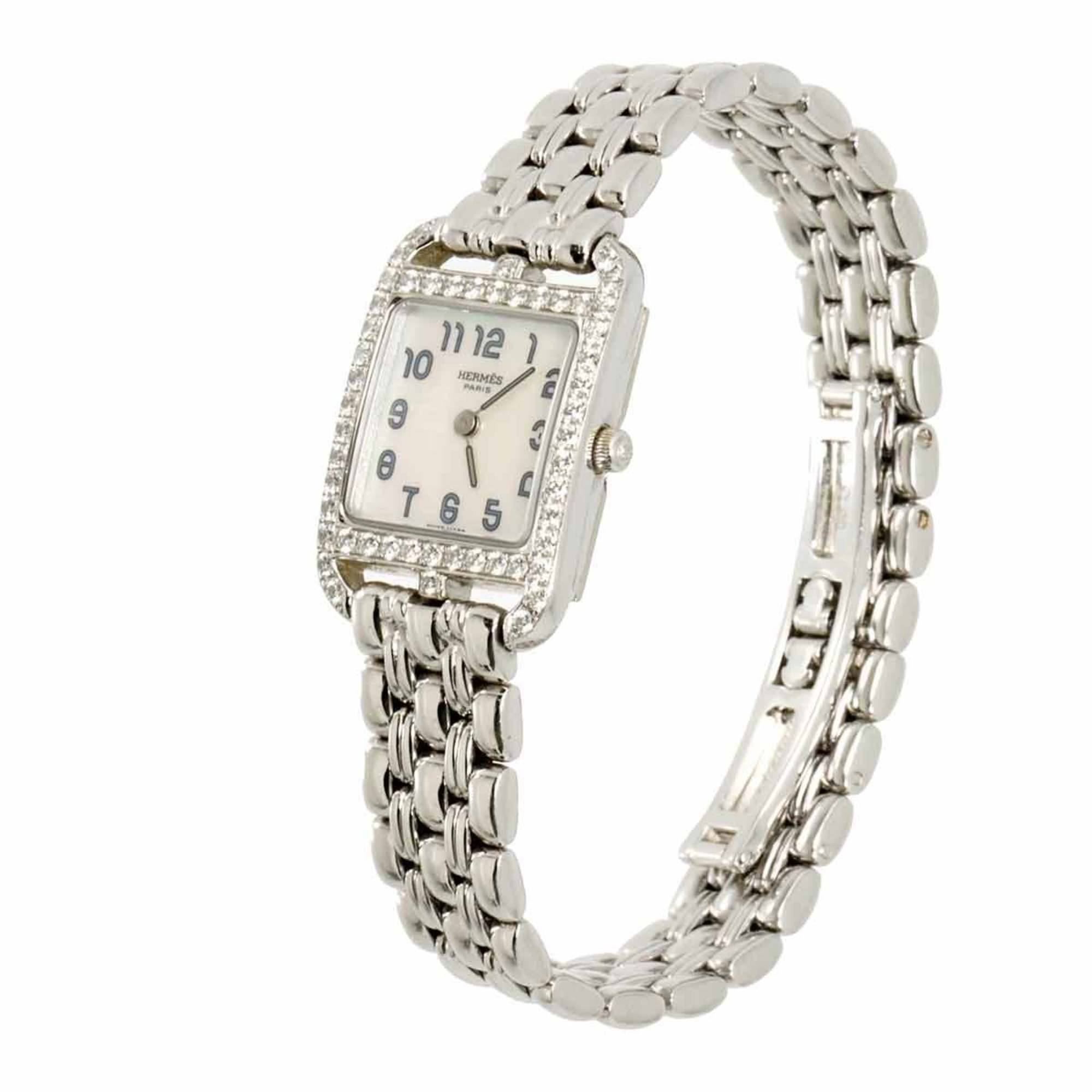 Herm&egrave;s Cape Cod Mini in 18ct gold with a diamond bezel and white shell dial