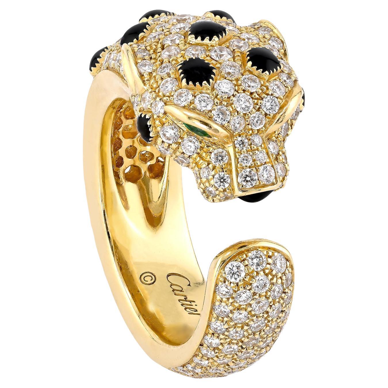 Panthère de Cartier gold ring with onyx spots and emerald eyes