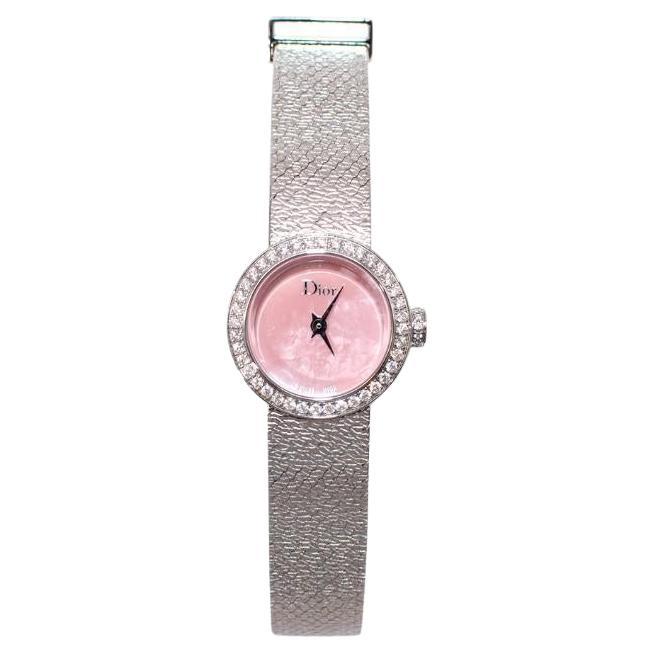 La Mini D de Dior Satine in steel with a diamond bezel and pink mother-of-pearl dial