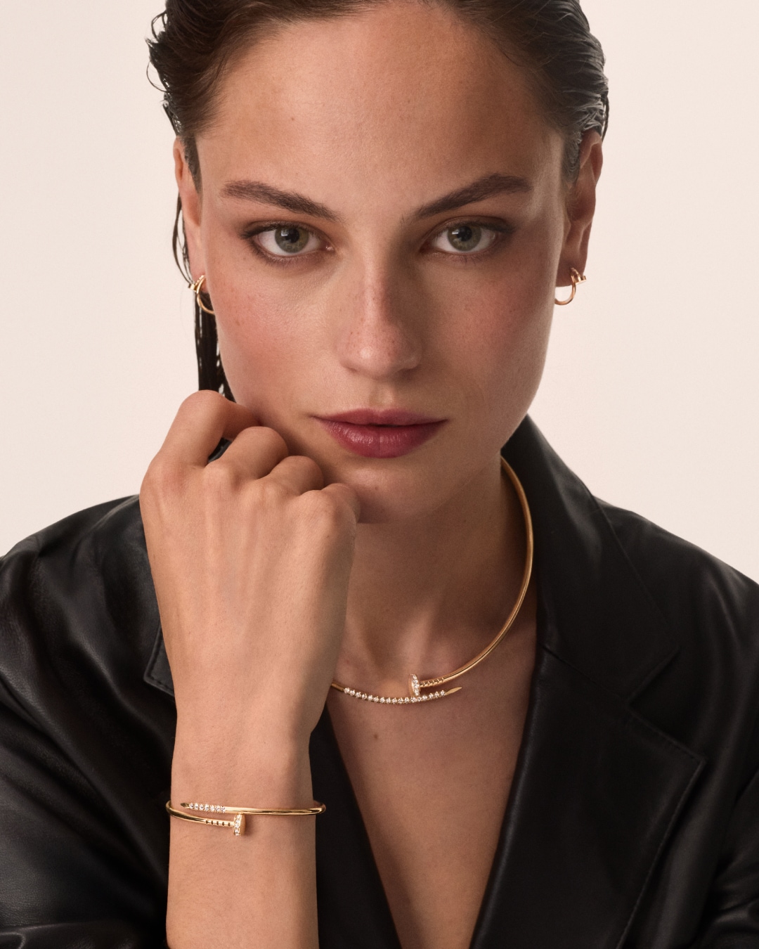 A lady wearing a Cartier Juste un Clou bracelet and nail necklace