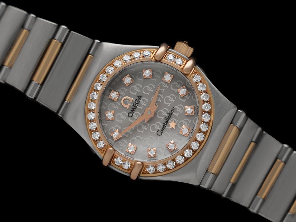 Omega Constellation ladies rose gold and steel watch with factory diamonds