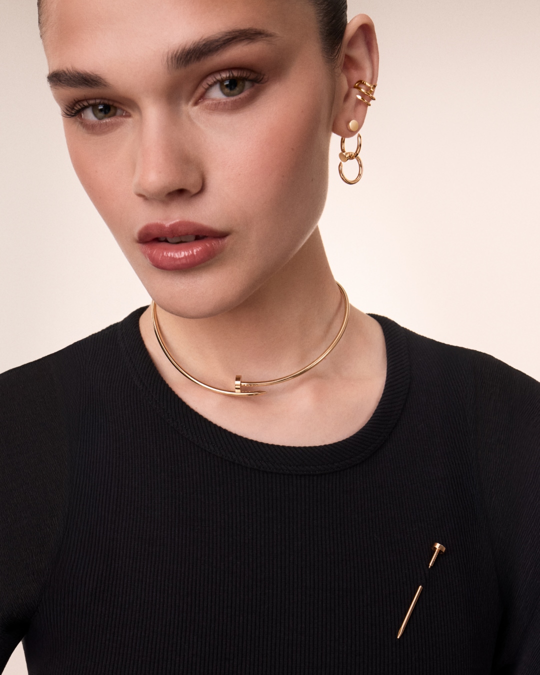 A lady wearing a Cartier Juste un Clou nail necklace