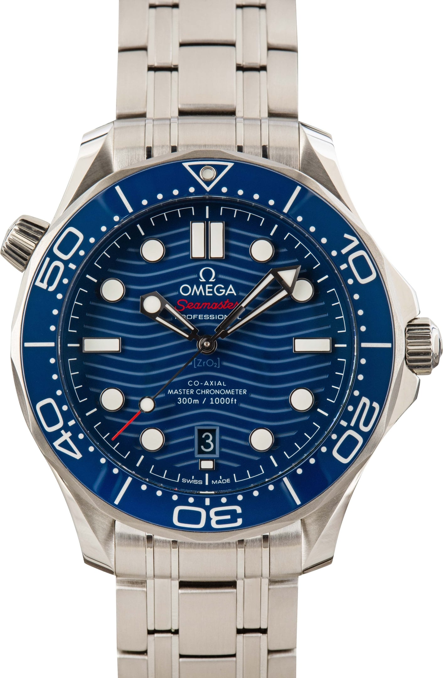 Omega Seamaster Diver 300M, steel, blue ceramic wave dial — the standard steel benchmark.